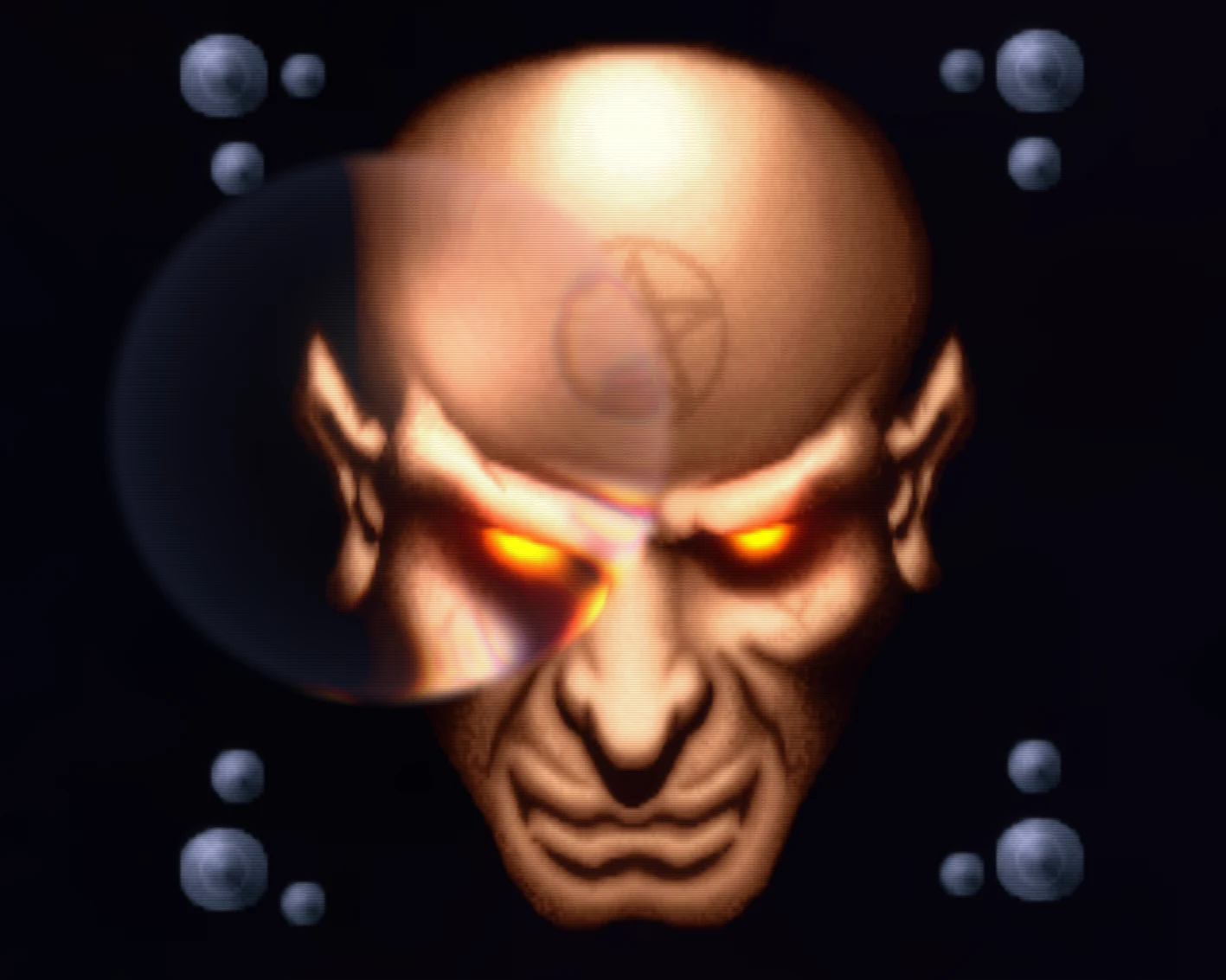 The remastered crystal ball effect: the demon's face with glowing orange eyes, seen through a glass sphere that refracts and catches the light, with small metal balls in the corners